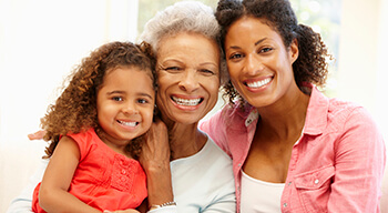 three generations of women smiling