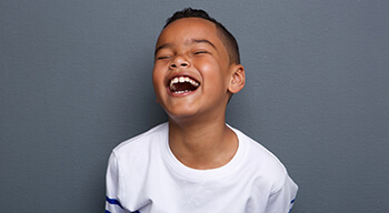 young boy laughing